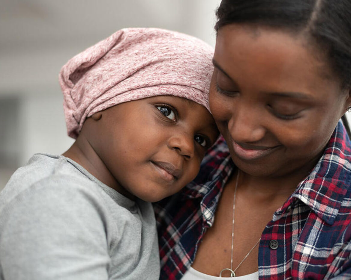 mother-of-african-descent-cuddles-her-child-who-has-cancer